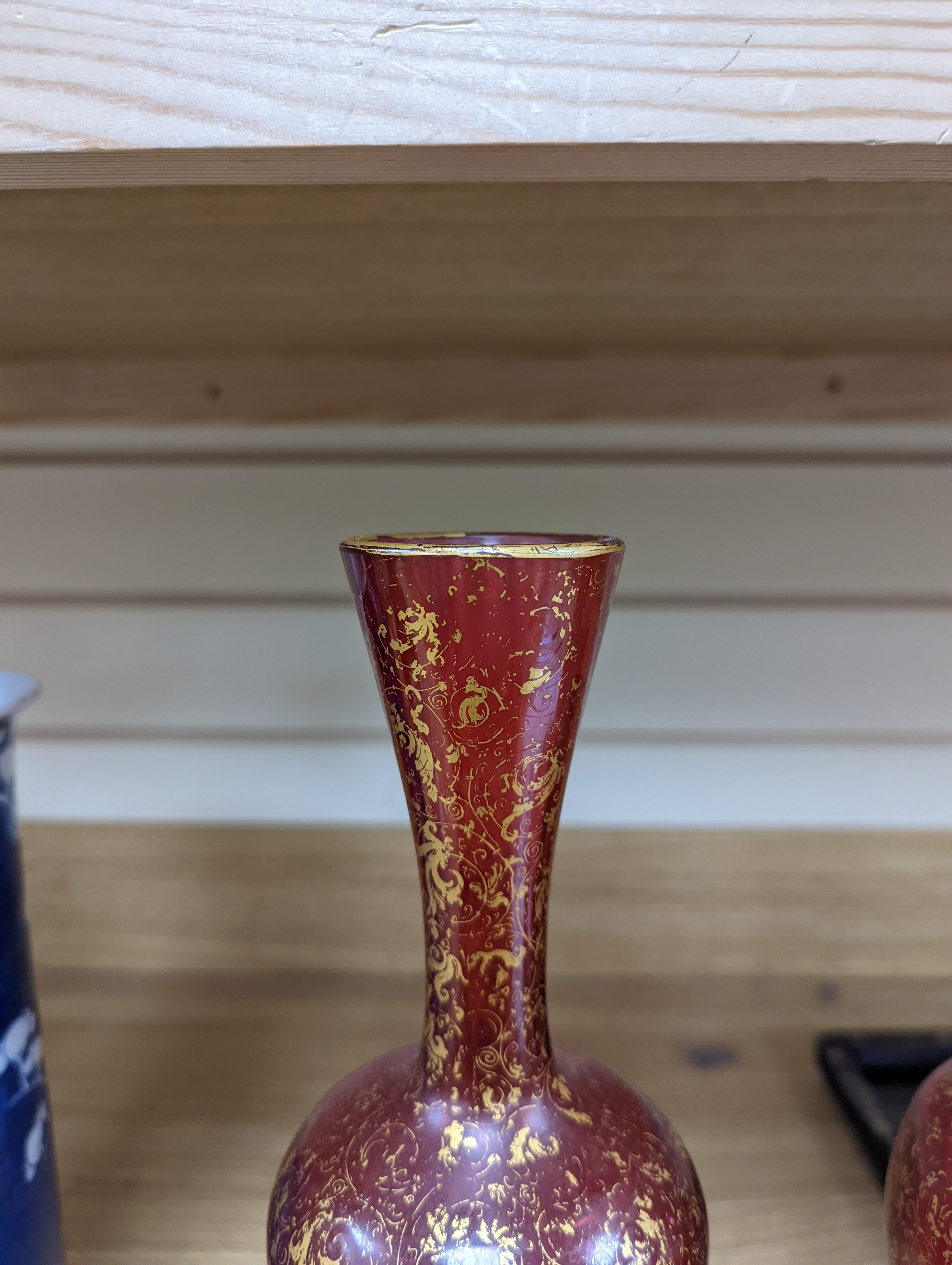 A pair of 19th century Bohemian enamelled and overlaid ruby glass vases 36cm